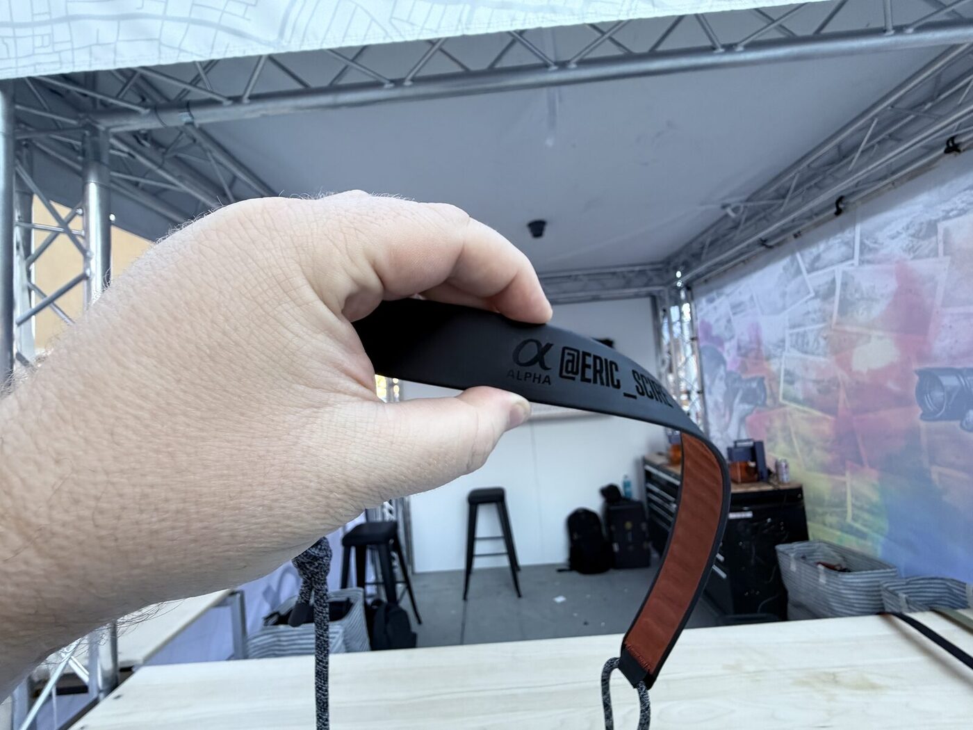 Freshly personalized strap with a guest's handle pressed at a brand booth
